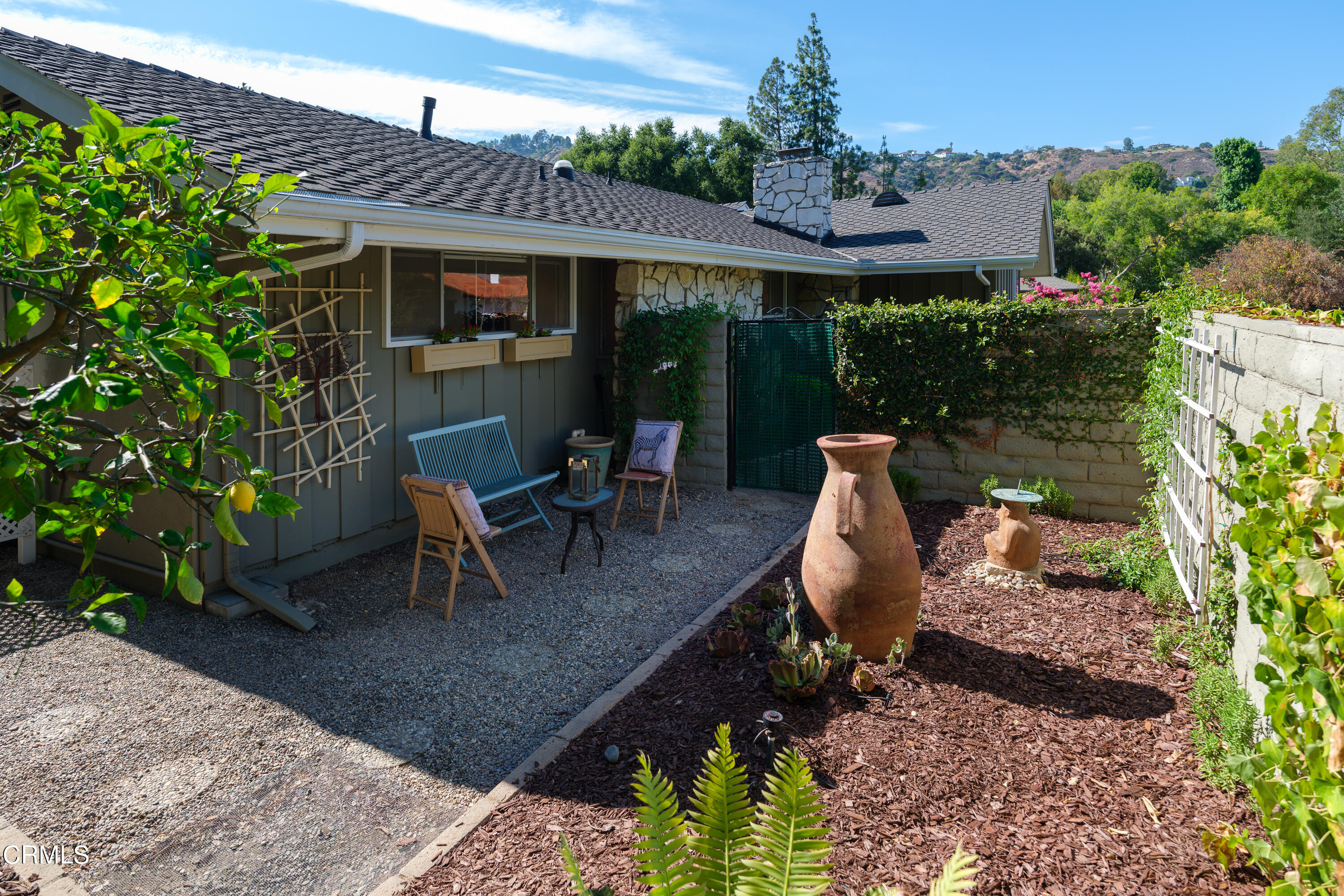 1450 Pegfair Estates Drive Pasadena, CA 91103 - Photo 49 of 58 a view of a patio with table and chairs potted plants