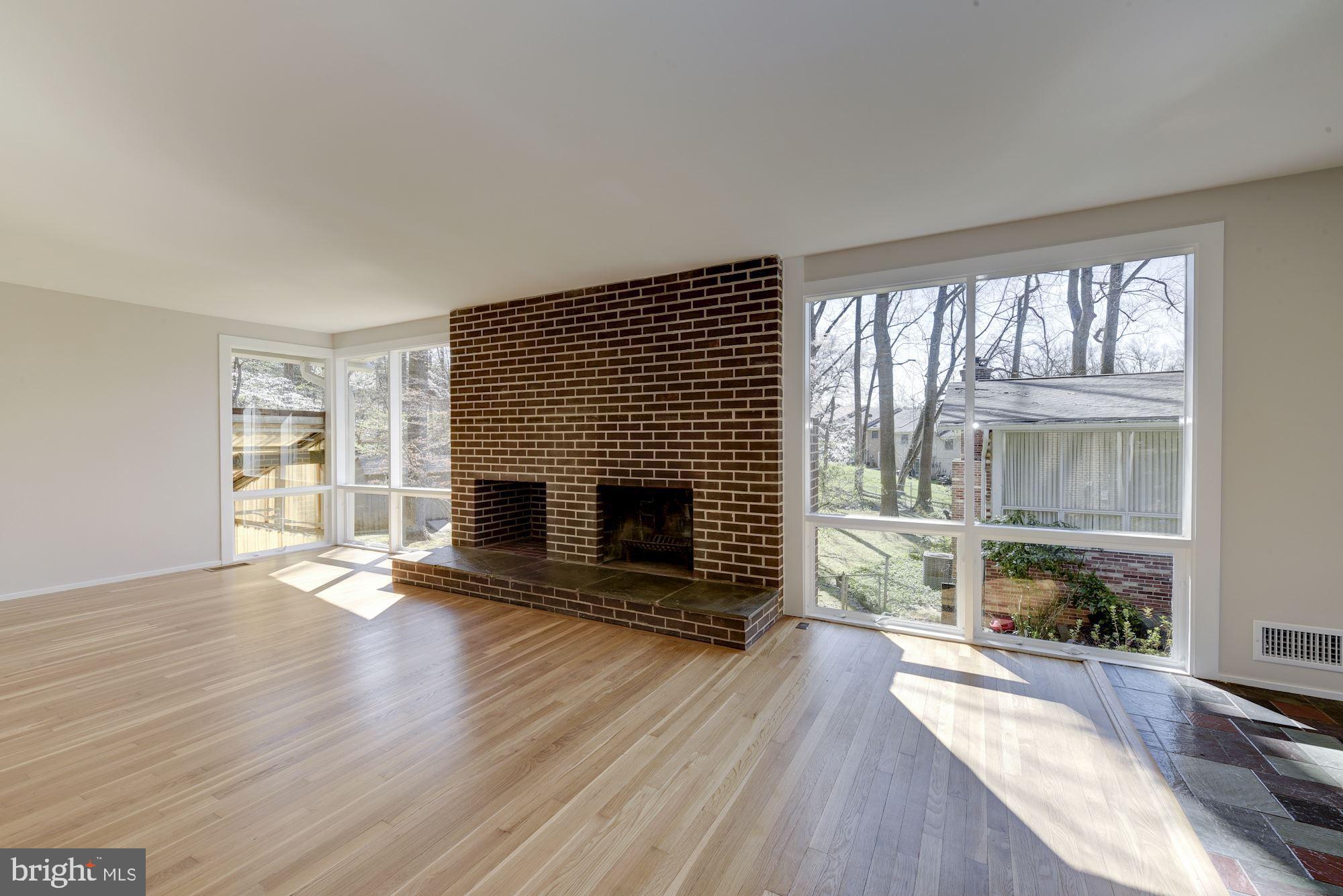 3700 Spruell Drive Silver Spring, MD 20902 - Photo 5 of 24 Living room with woodburning fireplace