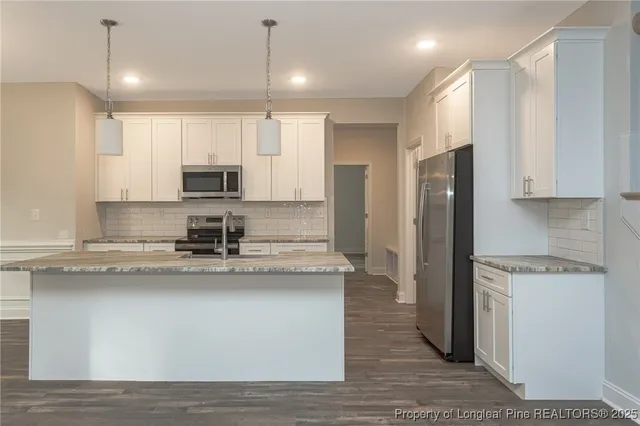 a bathroom with a shower and a sink