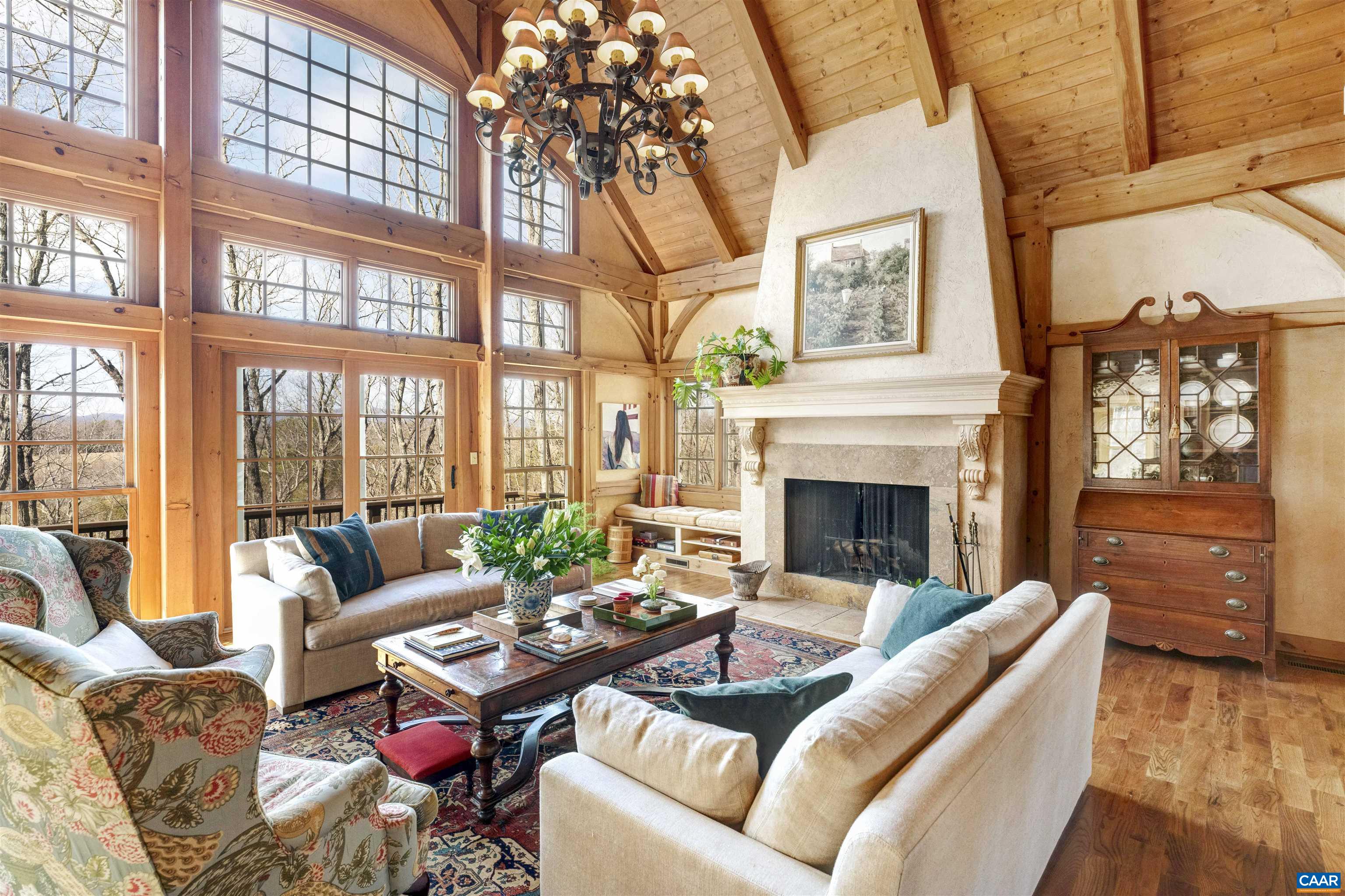 4414 Mt Alto Road Esmont, VA 22937 - Photo 11 of 68 a living room with furniture a fireplace and a large window