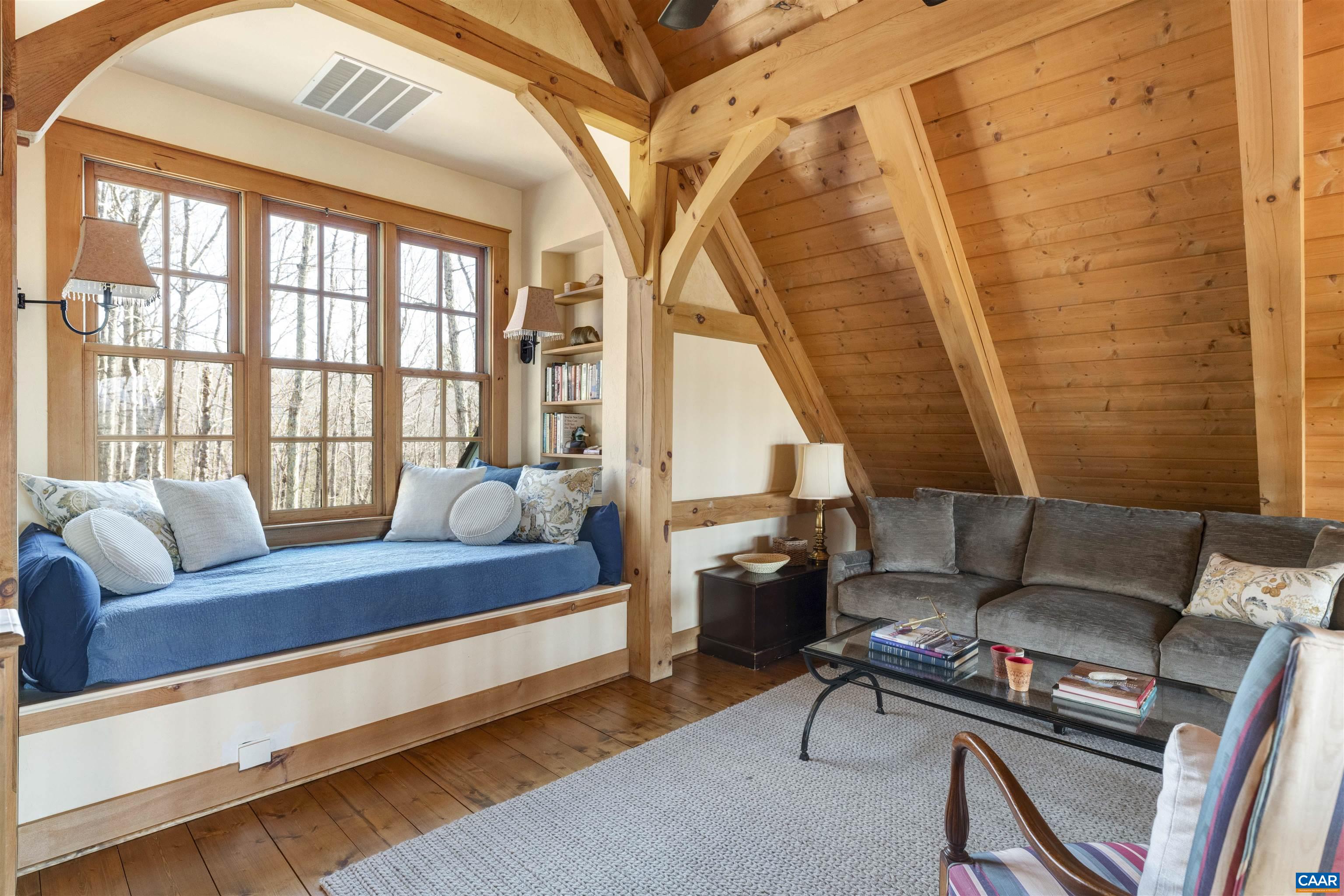 4414 Mt Alto Road Esmont, VA 22937 - Photo 36 of 68 a living room with furniture and a floor to ceiling window