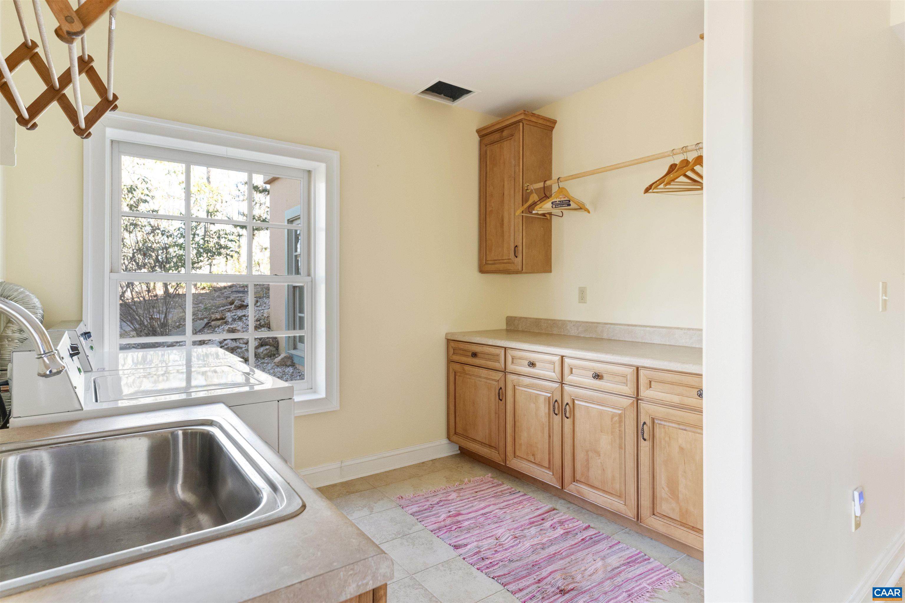 4414 Mt Alto Road Esmont, VA 22937 - Photo 41 of 68 a kitchen with granite countertop a sink and a window