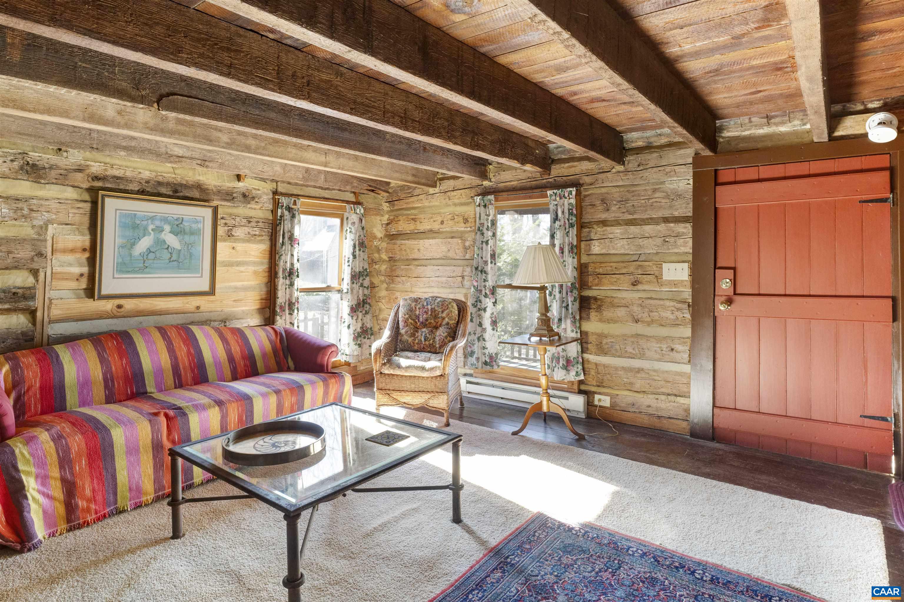 4414 Mt Alto Road Esmont, VA 22937 - Photo 47 of 68 a living room with furniture a rug and white walls