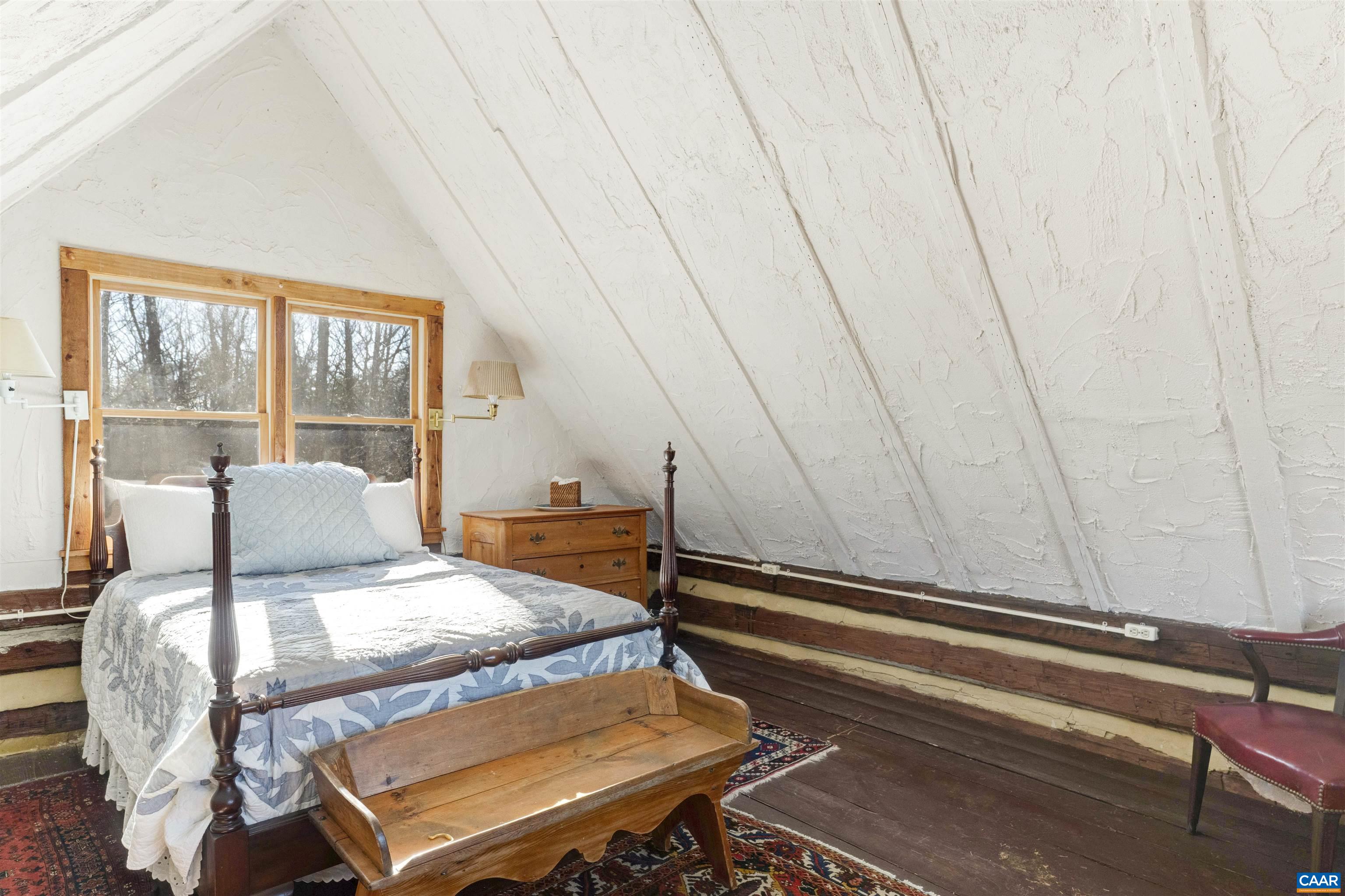 4414 Mt Alto Road Esmont, VA 22937 - Photo 51 of 68 a bedroom with a bed and wooden floor