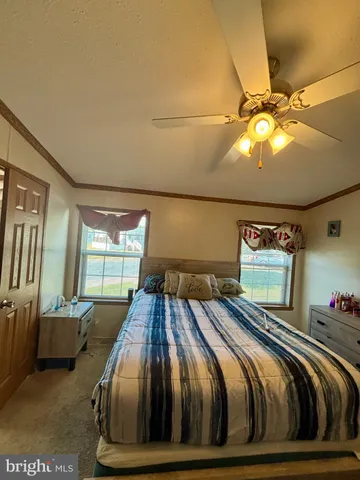 a bedroom with a bed and lamp