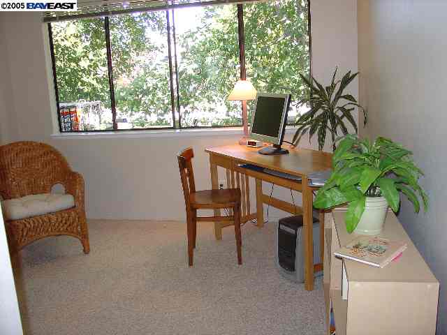 205 A Compton Circle San Ramon, CA 94583 - Photo 3 of 9 a workspace with furniture and a potted plant