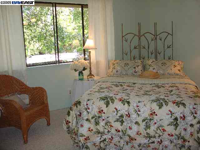 205 A Compton Circle San Ramon, CA 94583 - Photo 8 of 9 a bedroom with a bed and a window