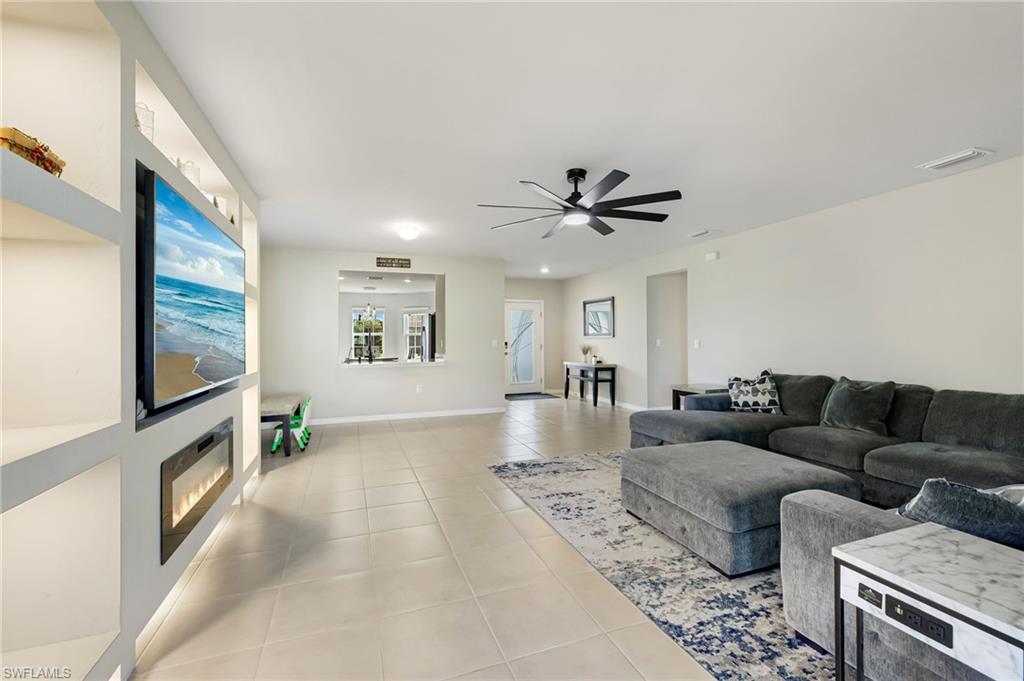 17544 Allentown Road Fort Myers, FL 33967 - Photo 8 of 20 Living room featuring light tile patterned floors and ceiling fan