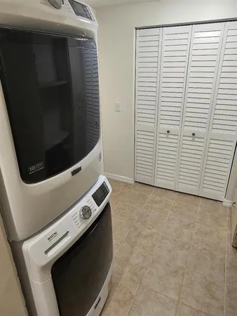a view of an empty room with a utility room