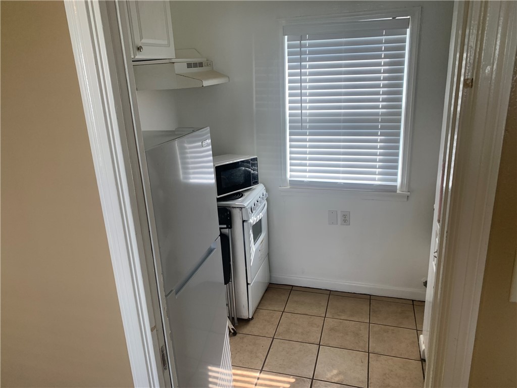 2801 Lawnview Street Corpus Christi, TX 78404 - Photo 7 of 11 a view of a storage and utility room with washer and dryer