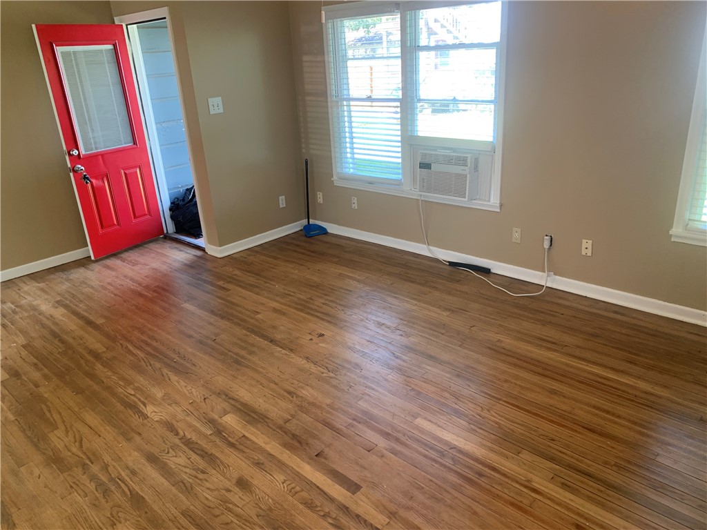 2801 Lawnview Street Corpus Christi, TX 78404 - Photo 10 of 11 an empty room with wooden floor and windows