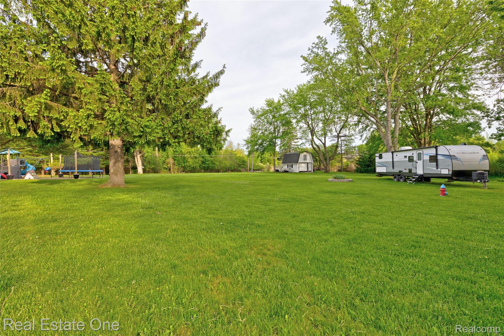 1574 Farnsworth Road Lapeer, MI 48446 - Photo 29 of 39 39) Side Yard.jpg