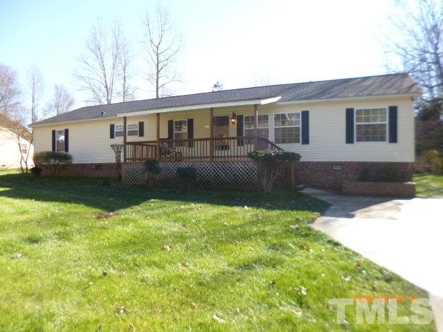 523 Poplar Springs Church Road Raleigh, NC 27603 - Photo 1 of 24 a front view of a house with garden