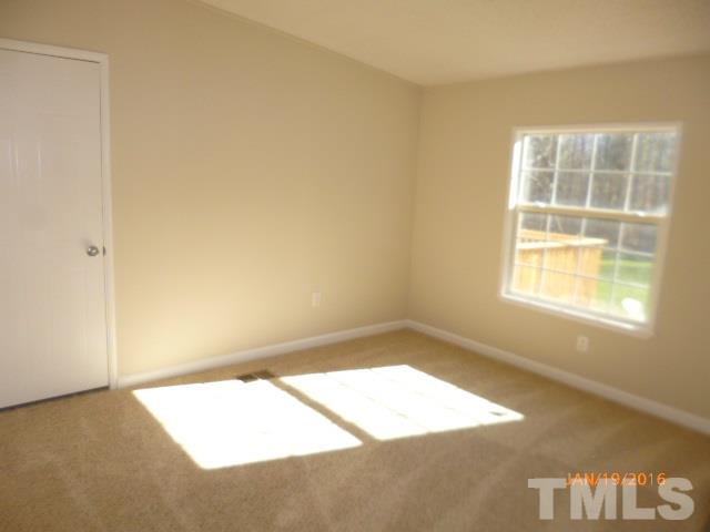 523 Poplar Springs Church Road Raleigh, NC 27603 - Photo 16 of 24 an empty room with a window