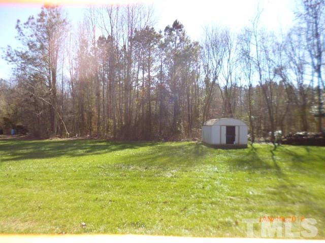 523 Poplar Springs Church Road Raleigh, NC 27603 - Photo 19 of 24 a backyard of a house with lots of green space