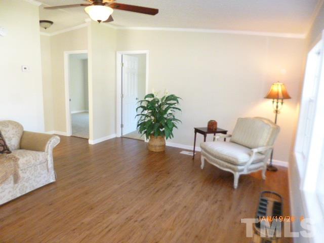 523 Poplar Springs Church Road Raleigh, NC 27603 - Photo 2 of 24 a living room with furniture and a potted plant