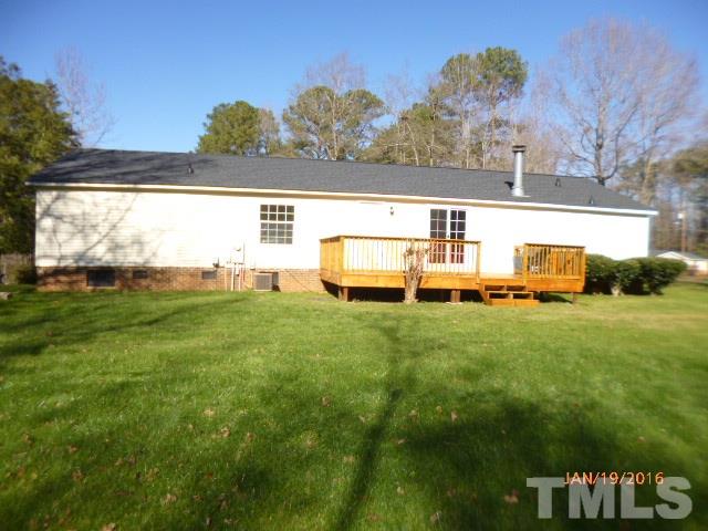 523 Poplar Springs Church Road Raleigh, NC 27603 - Photo 21 of 24 a view of a big yard with table and chairs
