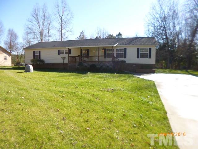 523 Poplar Springs Church Road Raleigh, NC 27603 - Photo 23 of 24 a view of an house with backyard space and garden