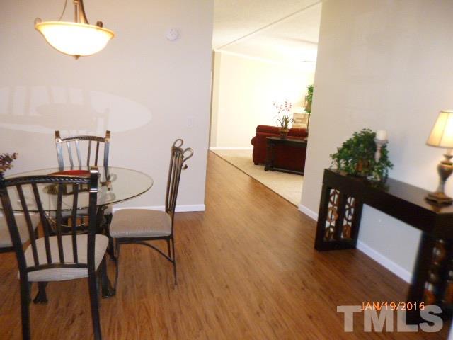 523 Poplar Springs Church Road Raleigh, NC 27603 - Photo 3 of 24 a living room with furniture and wooden floor