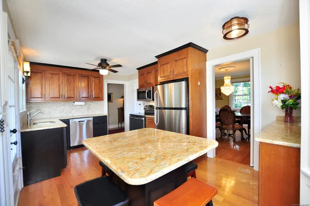 a kitchen with a table and chairs