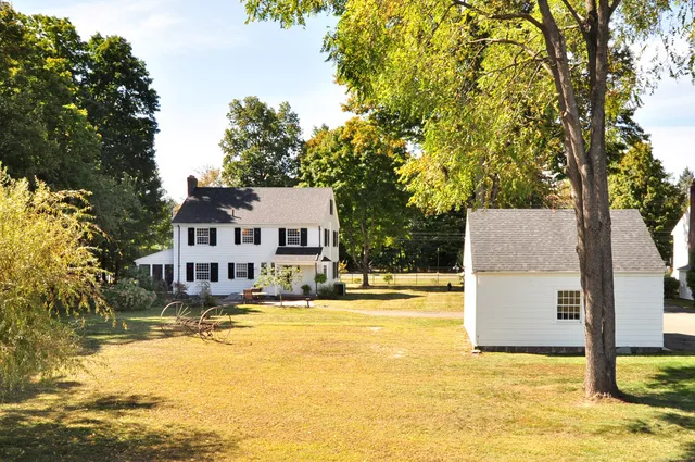 a view of a swimming pool with a house