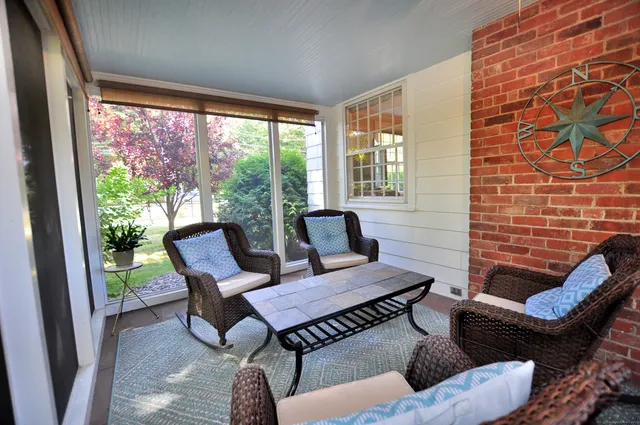 a outdoor living space with furniture and a rug