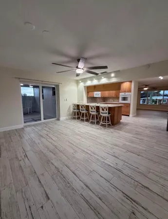a room with wooden floor and furniture