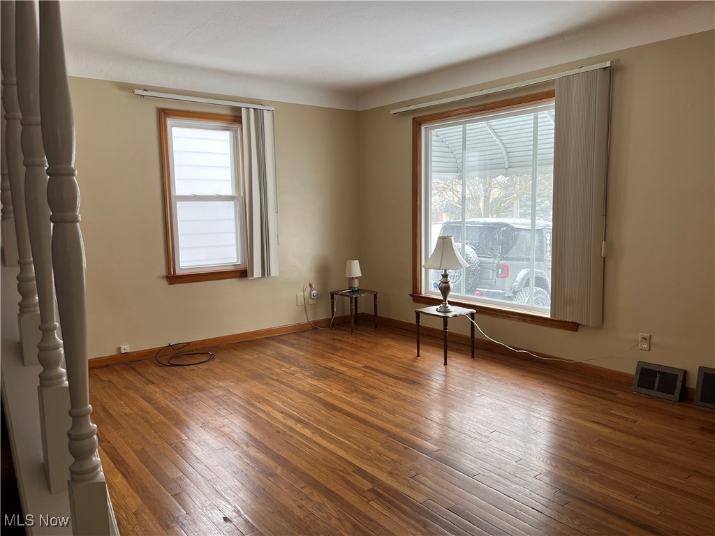 15405 Corkhill Road Maple Heights, OH 44137 - Photo 8 of 50 Large Living Room with hardwood floors and two windows.