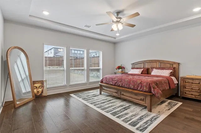 a bedroom with a large bed and a large window