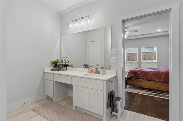 a kitchen with a sink and cabinets