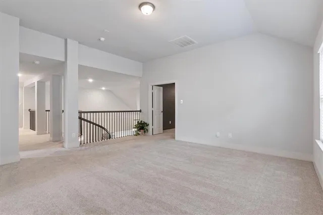 wooden floor with a projector in hallway