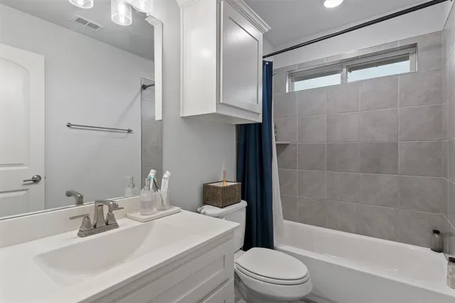 a bathroom with a sink a toilet and a bathtub