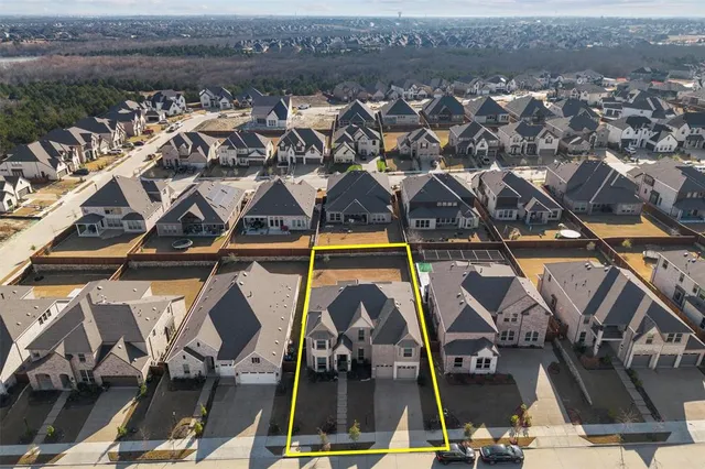 an aerial view of a house with a ocean view