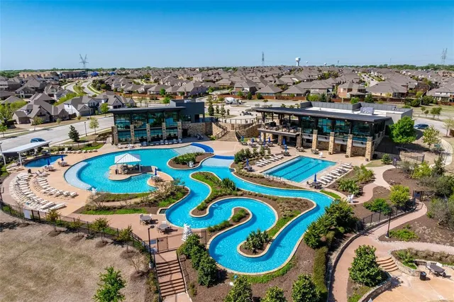 an aerial view of a swimming pool patio and mountain view