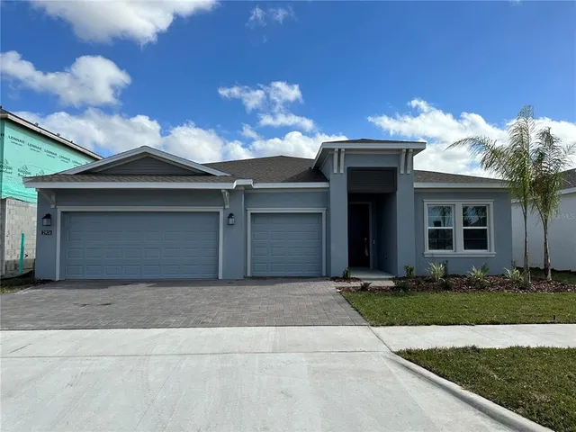 a front view of a house with yard