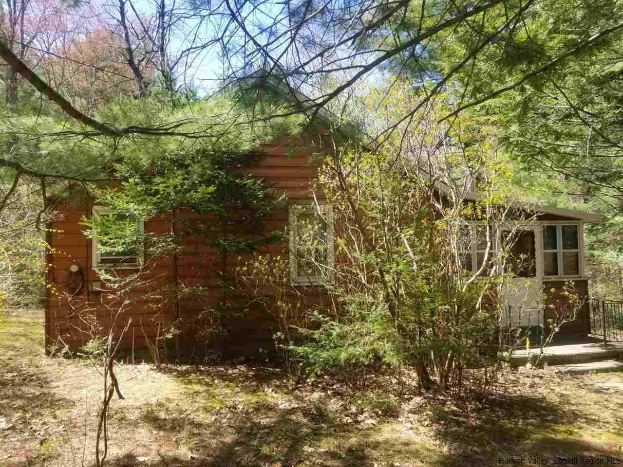 a view of house with yard