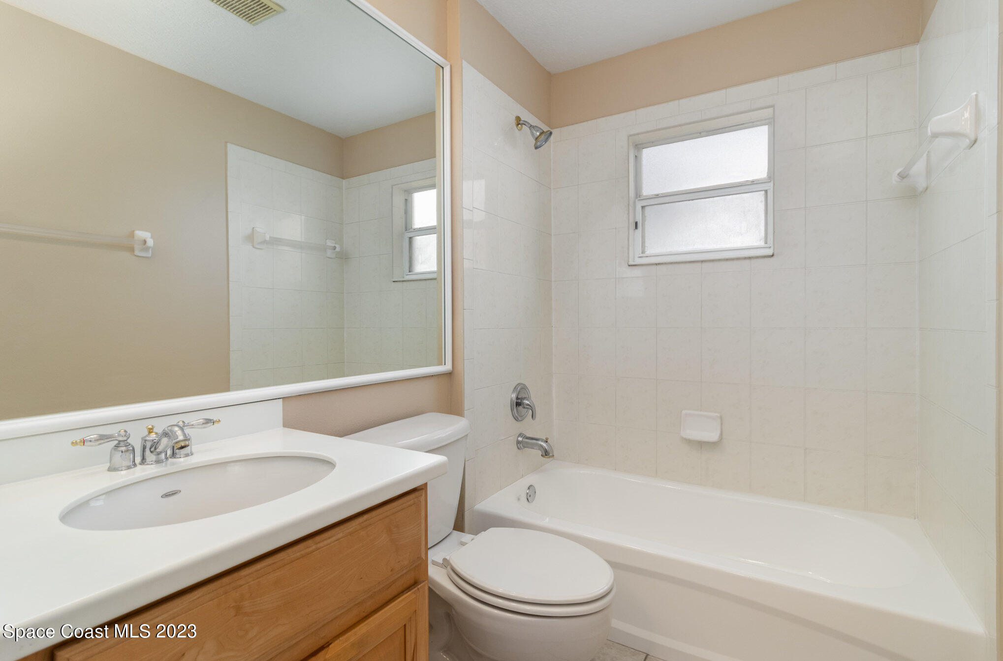 3504 Fodder Drive Rockledge, FL 32955 - Photo 18 of 20 a bathroom with a sink toilet and shower