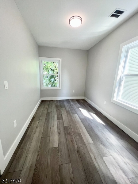 626 South 20th Street, Unit 3 Newark, NJ 07103 - Photo 8 of 11 wooden floor in an empty room with a window