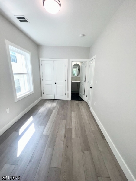 626 South 20th Street, Unit 3 Newark, NJ 07103 - Photo 9 of 11 a view of a room with wooden floor and window
