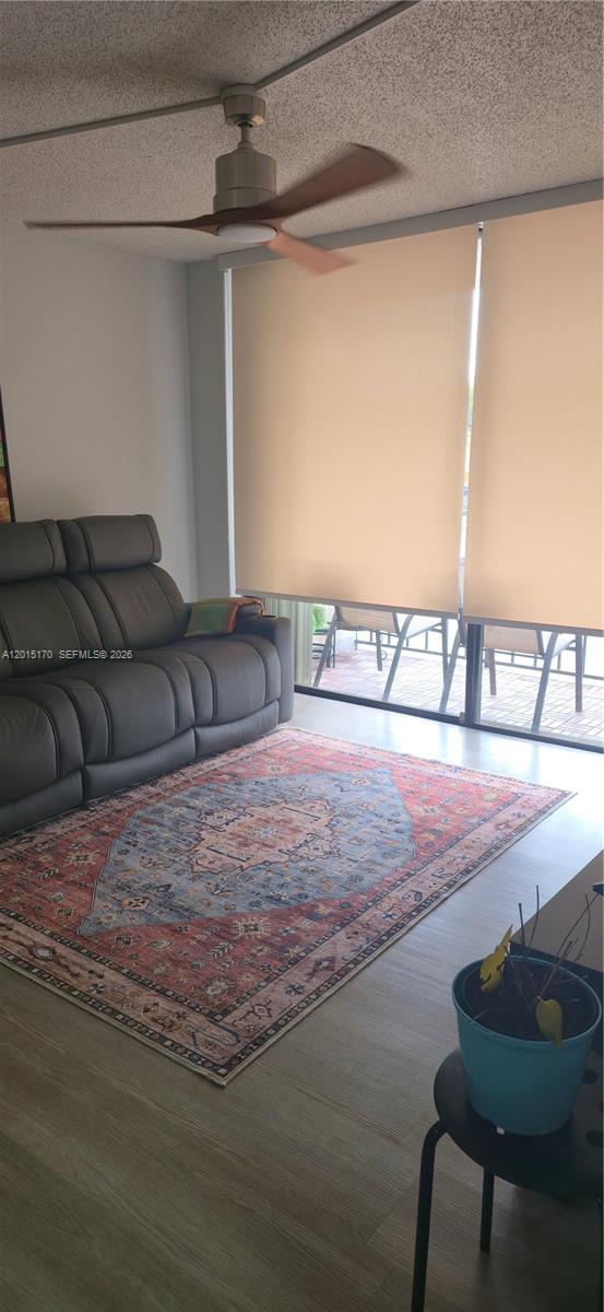 8002 Southwest 149th Avenue, Unit B216 Miami, FL 33193 - Photo 11 of 21 a bedroom with a bed and chair