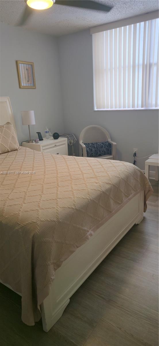 8002 Southwest 149th Avenue, Unit B216 Miami, FL 33193 - Photo 14 of 21 a bedroom with a bed and window