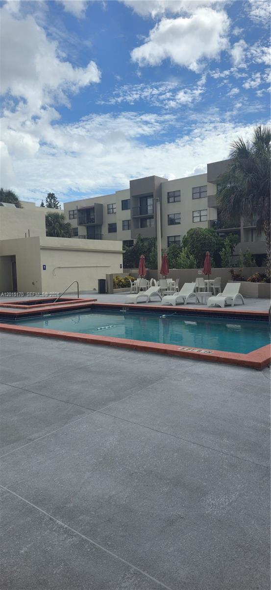 8002 Southwest 149th Avenue, Unit B216 Miami, FL 33193 - Photo 21 of 21 a view of a house with a garden and pathway