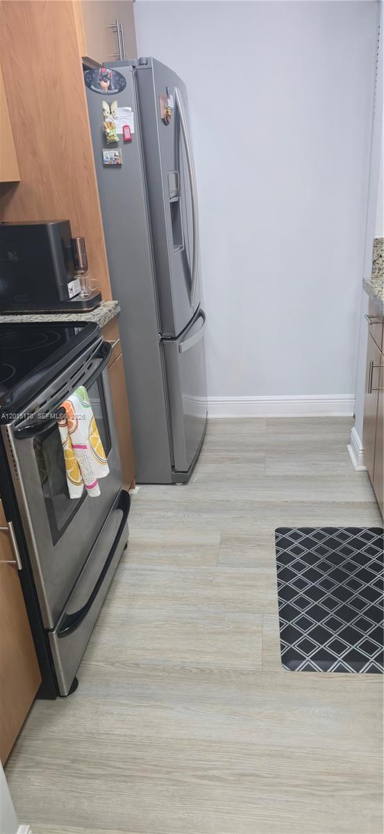8002 Southwest 149th Avenue, Unit B216 Miami, FL 33193 - Photo 8 of 21 a view of a fireplace with wooden floor