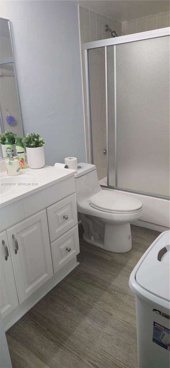 8002 Southwest 149th Avenue, Unit B216 Miami, FL 33193 - Photo 10 of 21 a bathroom with a double vanity sink toilet and shower