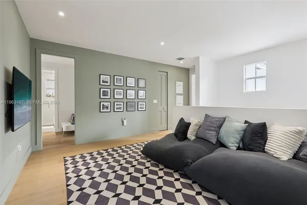 a bedroom with a bed and a book shelf