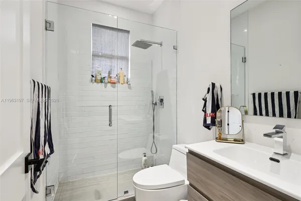 a spacious bedroom with a large bed and a window