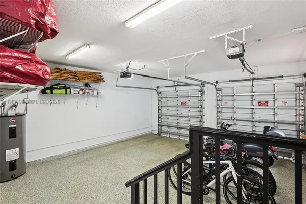 a view of a chairs and table in the backyard