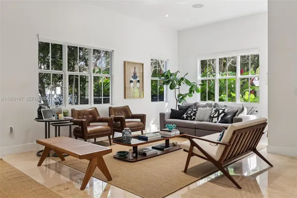 a living room with furniture and a window