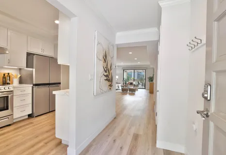 a view of a kitchen refrigerator and microwave