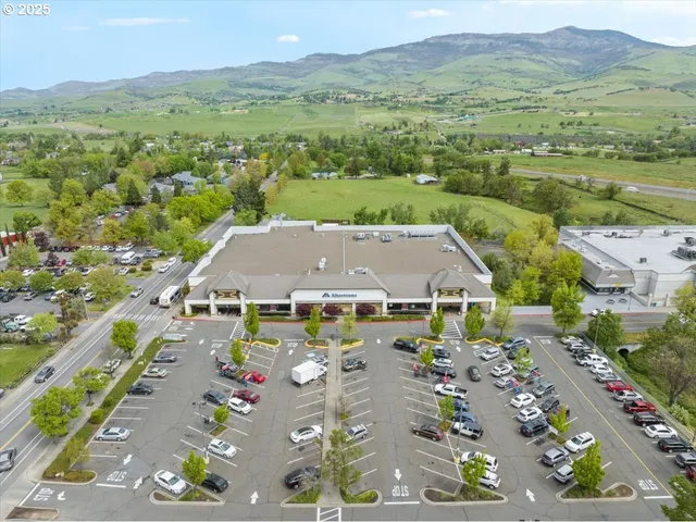 an aerial view of residential houses and outdoor space